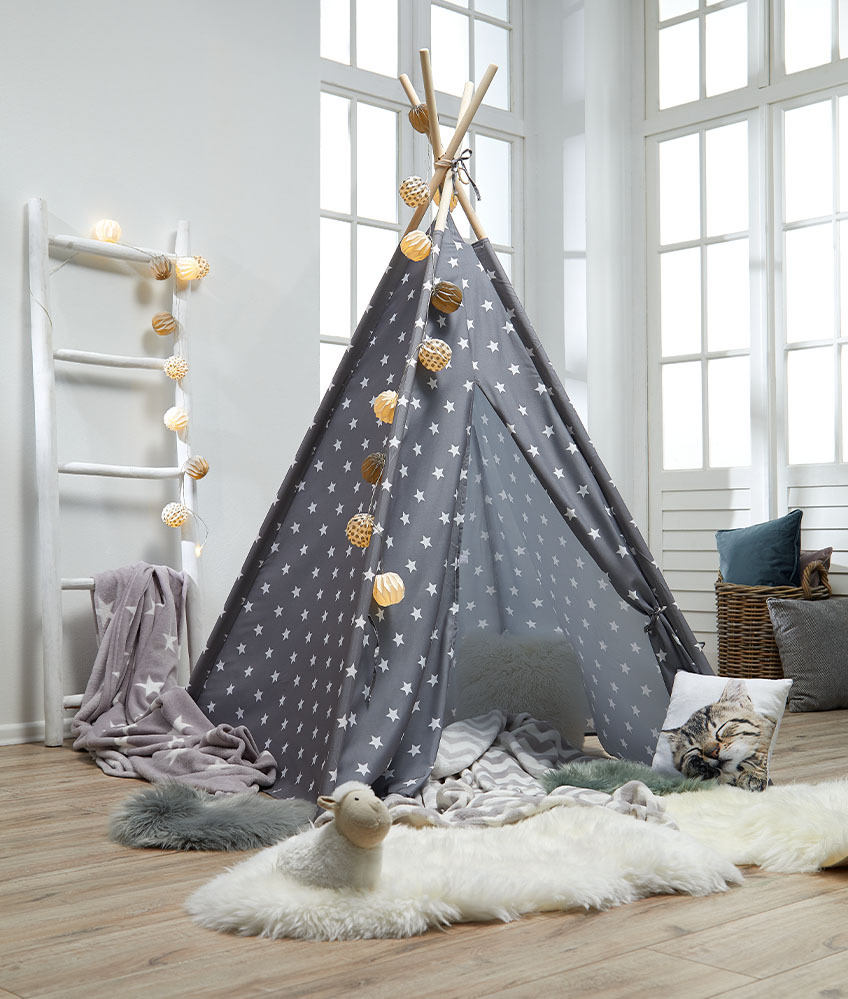 Children's play tent in grey with white stars and cosy decorations